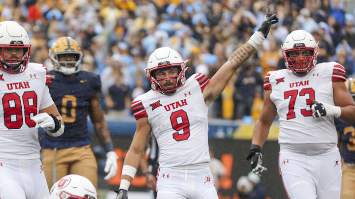 Utah Utes wide receiver Ryan Davis (9) celebrates a first down during the first quarter against the West Virginia Mountaineers at Milan Puskar Stadium. 