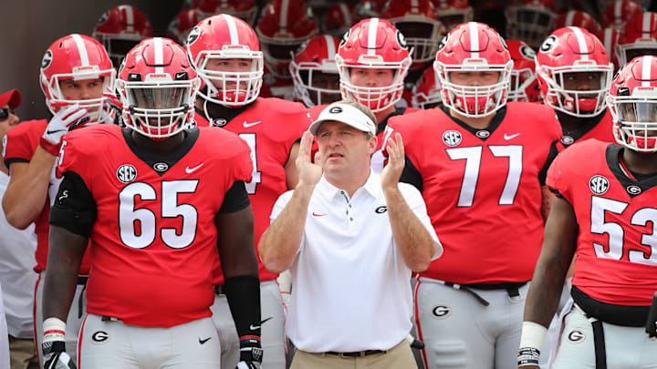 Oct 27, 2018; Jacksonville, FL, USA; Georgia Bulldogs head coach Kirby Smart gets ready to run out of the tunnel with offensive tackle Kendall Baker (65) and teammates against the Florida Gators at TIAA Bank Field. Mandatory Credit: Kim Klement-Imagn Images