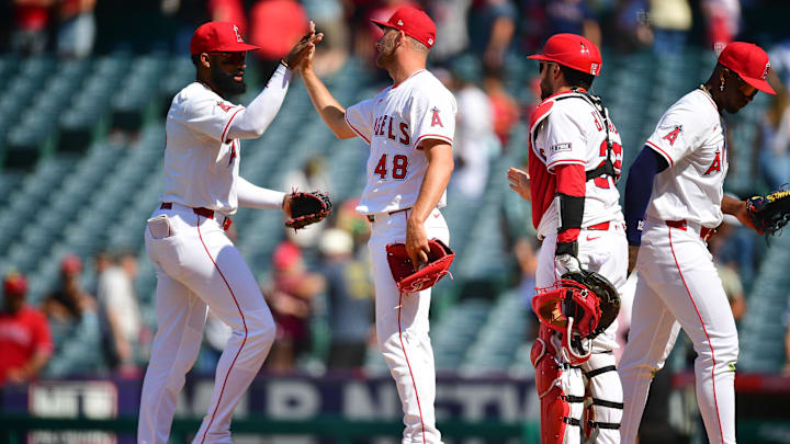 Jun 11, 2025; Anaheim, California, USA; Los Angeles Angels center fielder Jo Adell (7) pitcher Reid Detmers (48) catcher Travis d'Arnaud (25) celebrate the victory against the Athletics at Angel Stadium. Mandatory Credit: Gary A. Vasquez-Imagn Images Jun 11, 2025; Anaheim, California, USA; Los Angeles Angels center fielder Jo Adell (7) pitcher Reid Detmers (48) catcher Travis d'Arnaud (25) celebrate the victory against the Athletics at Angel Stadium. Mandatory Credit: Gary A. Vasquez-Imagn Images