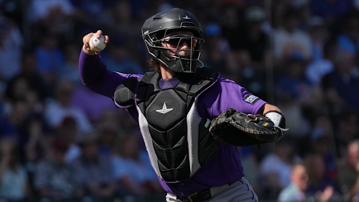 Feb 25, 2026; Mesa, Arizona, USA; Colorado Rockies catcher Hunter Goodman (15) makes the play for an out against the Chicago Cubs in the first inning at Sloan Park. Mandatory Credit: Rick Scuteri-Imagn Images Feb 25, 2026; Mesa, Arizona, USA; Colorado Rockies catcher Hunter Goodman (15) makes the play for an out against the Chicago Cubs in the first inning at Sloan Park. Mandatory Credit: Rick Scuteri-Imagn Images