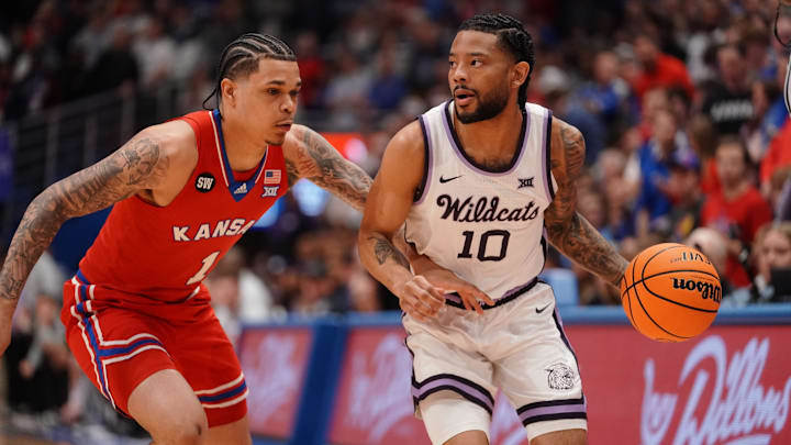Kansas State Wildcats guard David Castillo (10) drives the ball against Kansas Jayhawks guard Jayden Dawson (1) during the Sunflower Showdown game inside Allen Fieldhouse in Lawrence, Kansas, on Saturday, March 7, 2026.