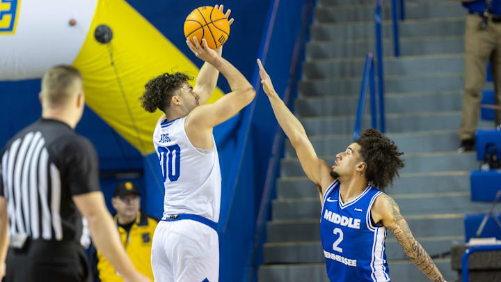 Delaware Hens guard Christian Bliss (00) shoots over Middle Tennessee guard Jahvin Carter (2) during the NCAA college basketball game between the Delaware Hens and the Middle Tennessee Blue Raiders on Saturday, Feb. 7, 2026, at The Bob Carpenter Sports Convocation Center in Newark, Delaware.Delaware Hens guard Christian Bliss (00) shoots over Middle Tennessee guard Jahvin Carter (2) during the NCAA college basketball game between the Delaware Hens and the Middle Tennessee Blue Raiders on Feb. 7,