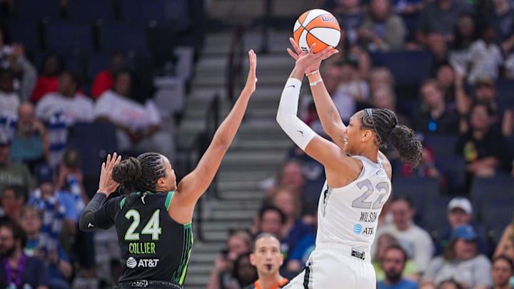Jul 25, 2025; Minneapolis, Minnesota, USA; Las Vegas Aces center A'ja Wilson (22) shoots against the Minnesota Lynx forward Napheesa Collier (24) in the third quarter at Target Center. Mandatory Credit: Brad Rempel-Imagn Images Jul 25, 2025; Minneapolis, Minnesota, USA; Las Vegas Aces center A'ja Wilson (22) shoots against the Minnesota Lynx forward Napheesa Collier (24) in the third quarter at Target Center. Mandatory Credit: Brad Rempel-Imagn Images
