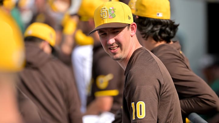 San Diego Padres pitcher Walker Buehler (10) looks on from the dugout in the fifth inning against the Milwaukee Brewers at Peoria Sports Complex on Feb. 23, 2026.