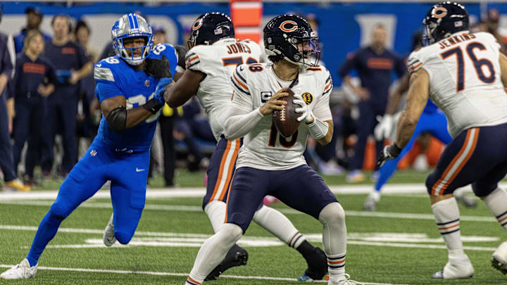 Caleb Williams sets up to pass as former Bears pass rusher Al-Quadin Muhammad tries to pressure from behind.
