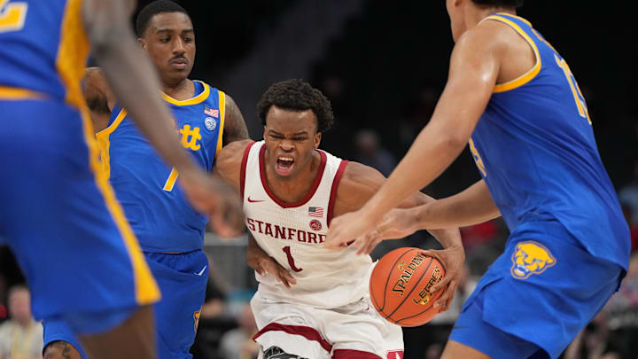 Mar 10, 2026; Charlotte, NC, USA; Stanford Cardinal guard Ebuka Okorie (1) with the ball as Pittsburgh Panthers guard Damarco Minor (7) and forward Roman Siulepa (13) defend in the second half at Spectrum Center. Mandatory Credit: Bob Donnan-Imagn Images