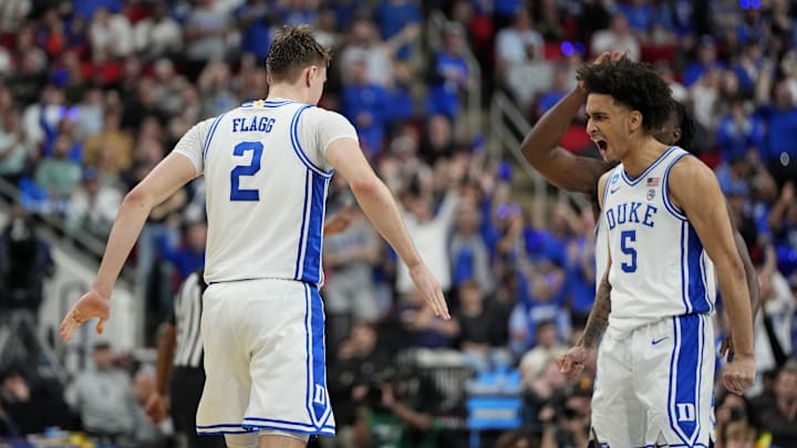 Mar 23, 2025; Raleigh, NC, USA; Duke Blue Devils forward Cooper Flagg (2) reacts after scoring a basket with Duke Blue Devils guard Tyrese Proctor (5) during the first half against the Baylor Bears in the second round of the NCAA Tournament at Lenovo Center. Mandatory Credit: Bob Donnan-Imagn Images