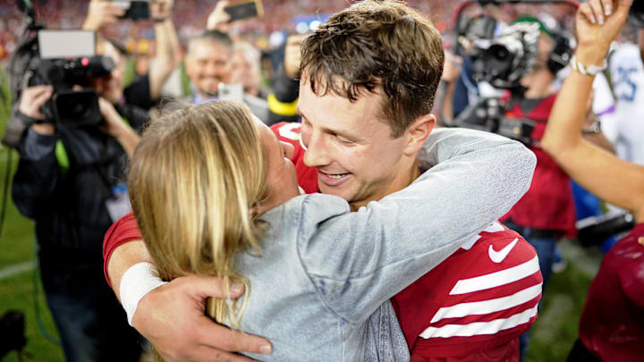 San Francisco 49ers quarterback Brock Purdy (13) kisses his fiance Jenna Brandt after winning the NFC Championship football game against the Detroit Lions at Levi's Stadium.
