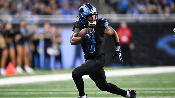 Detroit Lions running back Jahmyr Gibbs (0) runs with the ball for a touchdown during the fourth quarter against the New York Giants at Ford Field. 