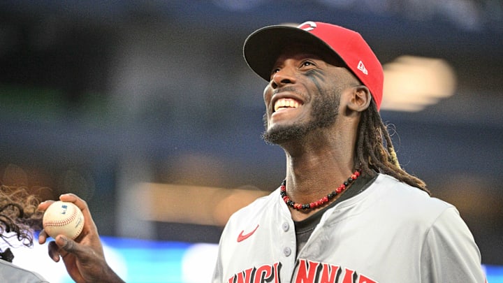 Aug 19, 2024; Toronto, Ontario, CAN; Cincinnati Reds shortstop Ely De La Cruz (44) smiles at fans as he prepares to throw a ball to the crowd in the third inning against the Toronto Blue Jays at Rogers Centre. Mandatory Credit: Dan Hamilton-Imagn Images
