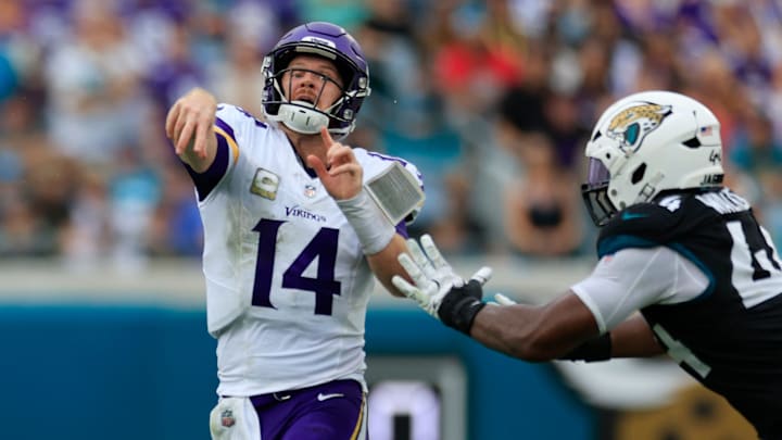 Minnesota Vikings quarterback Sam Darnold (14) is pressured by Jacksonville Jaguars defensive end Travon Walker (44) during the fourth quarter of an NFL football matchup Sunday, Nov. 10, 2024 at Everbank Stadium in Jacksonville, Fla. The Vikings defeated the Jaguars 12-7. [Corey Perrine/Florida Times-Union]