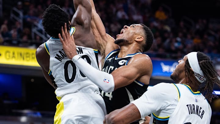 Dec 31, 2024; Indianapolis, Indiana, USA; Indiana Pacers guard Bennedict Mathurin (00) blocks the shot of Milwaukee Bucks forward Giannis Antetokounmpo (34) in the second half at Gainbridge Fieldhouse. Mandatory Credit: Trevor Ruszkowski-Imagn Images Dec 31, 2024; Indianapolis, Indiana, USA; Indiana Pacers guard Bennedict Mathurin (00) blocks the shot of Milwaukee Bucks forward Giannis Antetokounmpo (34) in the second half at Gainbridge Fieldhouse. Mandatory Credit: Trevor Ruszkowski-Imagn Images
