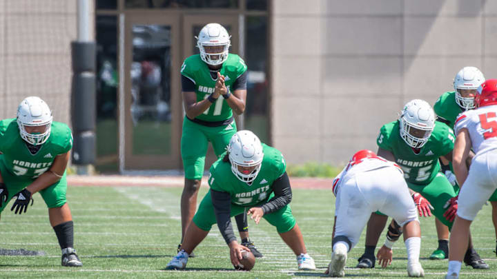 San Diego Lincoln QB Akili Smith about to take a snap from center. Smith and the Hornets take on Cathedral Catholic Friday in a huge San Diego Section game between two ranked California Top 25 teams. 