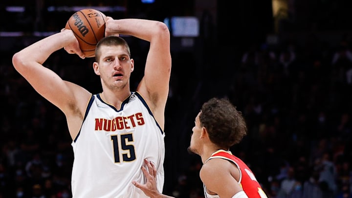 Denver Nuggets center Nikola Jokic (15) controls the ball as Atlanta Hawks guard Trae Young (11) defends in the second quarter at Ball Arena. Mandatory Credit: Isaiah J. Downing-Imagn Images