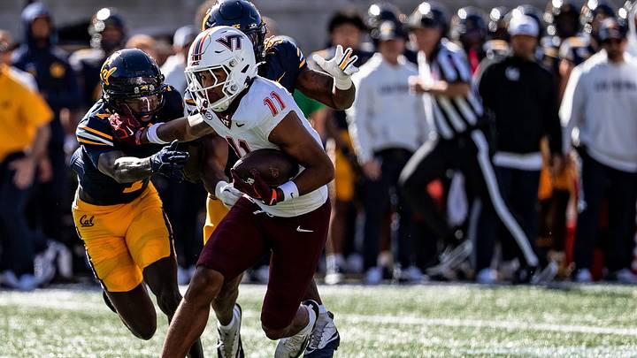 Davion "FatRat" Brown stiff-arms a defender against Cal on Oct. 10, 2026.