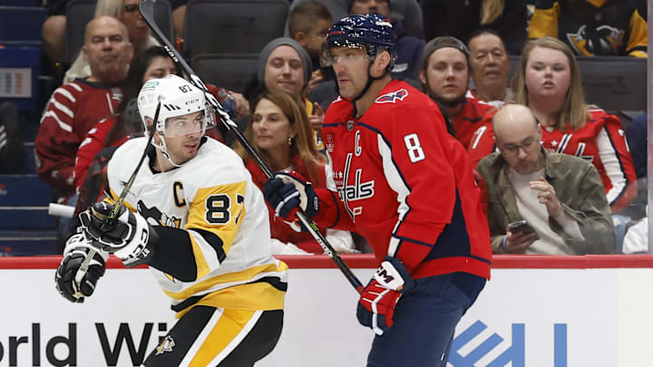 Pittsburgh Penguins center Sidney Crosby and Washington Capitals left wing Alex Ovechkin skate.