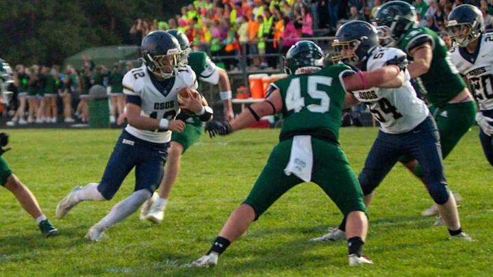 Colorado Springs Christian quarterback Fisher Tenpas (with ball) scrambles for space during a recent ballgame. Colorado Springs Christian quarterback Fisher Tenpas (with ball) scrambles for space during a recent ballgame.