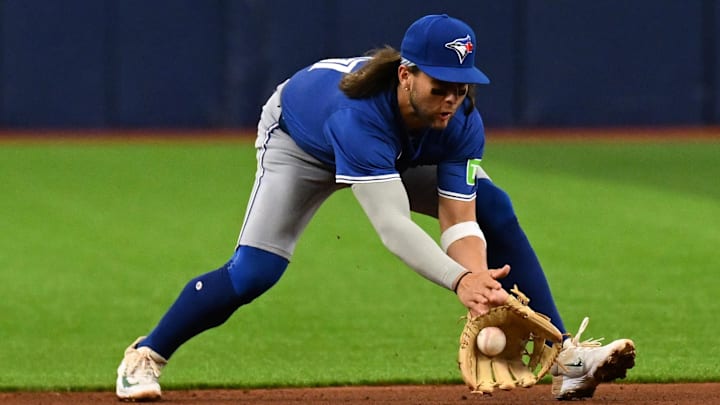 Mar 30, 2024; St. Petersburg, Florida, USA; Toronto Blue Jays shortstop Bo Bichette (11) fields a Mar 30, 2024; St. Petersburg, Florida, USA; Toronto Blue Jays shortstop Bo Bichette (11) fields a