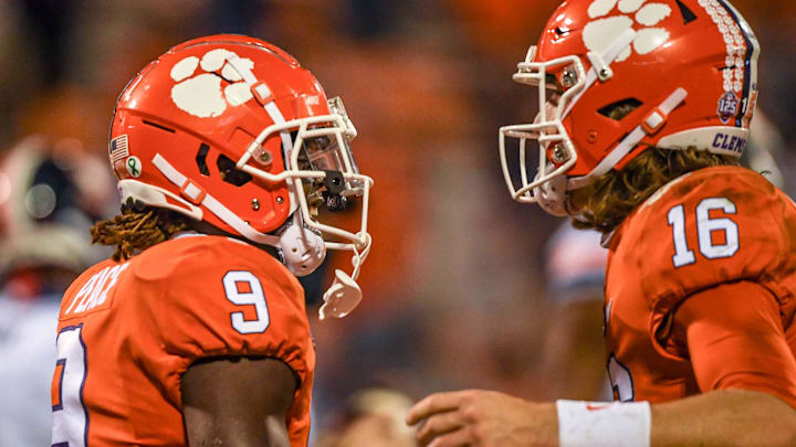 Clemson running back Travis Etienne (9) is congratulated by  quarterback Trevor Lawrence (16) after he scored during the third quarter on Saturday, October 3, 2020 in Clemson, S.C.

Ncaa Football Virginia At Clemson
