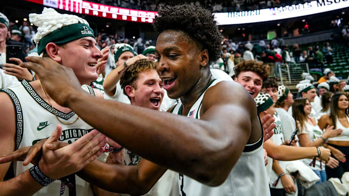 Michigan State's Cam Ward celebrates with fans after the Spartans victory over Arkansas on Saturday, Nov. 8, 2025, at the Breslin Center in East Lansing.