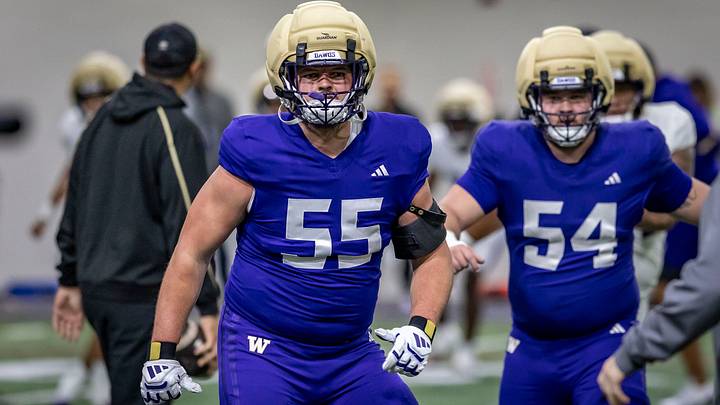 Kolt Dieterich (55) moves through a spring drill ahead of Parker Cross. Kolt Dieterich (55) moves through a spring drill ahead of Parker Cross.