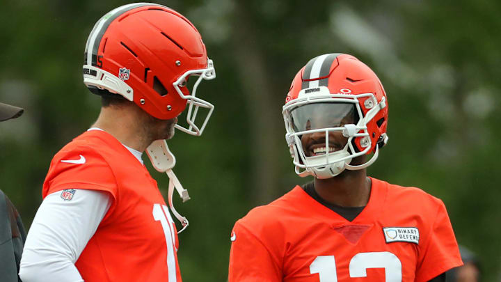 Cleveland Browns quarterback Joe Flacco, left, chats with rookie Shedeur Sanders during an NFL practice.