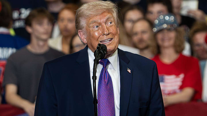 U.S. President Donald Trump jokes with the crowd while speaking during an event at Verst Logistics on March 11, 2026 in Hebron, Kentucky.