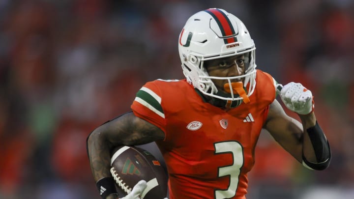 Sep 9, 2023; Miami Gardens, Florida, USA; Miami Hurricanes wide receiver Jacolby George (3) runs with the football for a touchdown against the Texas A&M Aggies during the fourth quarter at Hard Rock Stadium. Mandatory Credit: Sam Navarro-USA TODAY Sports Sep 9, 2023; Miami Gardens, Florida, USA; Miami Hurricanes wide receiver Jacolby George (3) runs with the football for a touchdown against the Texas A&M Aggies during the fourth quarter at Hard Rock Stadium. Mandatory Credit: Sam Navarro-USA TODAY Sports