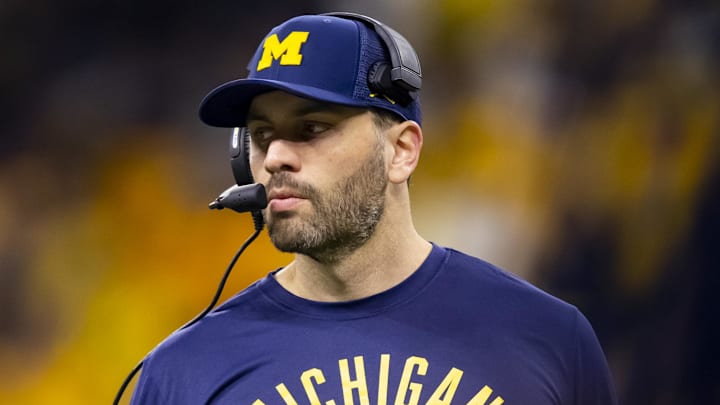 Dec 4, 2021; Indianapolis, IN, USA; Michigan Wolverines quarterbacks coach Matt Weiss against the Iowa Hawkeyes in the Big Ten Conference championship game at Lucas Oil Stadium.