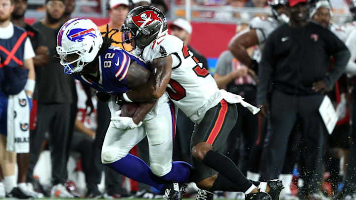 Aug 23, 2025; Tampa, Florida, USA; Tampa Bay Buccaneers wide receiver Jacob Harris (30) tackles Buffalo Bills wide receiver Kristian Wilkerson (82)