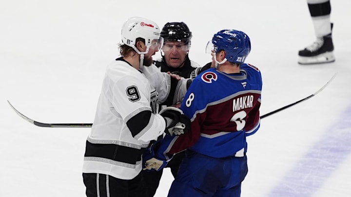 Apr 19, 2026; Denver, Colorado, USA; Los Angeles Kings right wing Adrian Kempe (9) and Colorado Avalanche defenseman Cale Makar (8) fight during the third period in game one of the first round of the 2026 Stanley Cup Playoffs at Ball Arena. Mandatory Credit: Ron Chenoy-Imagn Images