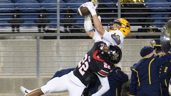 St. Ignatius   s Cody Haddad makes a third-quarter touchdown reception over McKinley   s Geno Kelly, Friday, Nov. 3, 2023.