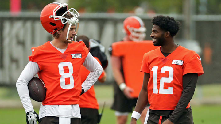 Cleveland Browns quarterback Kenny Pickett, left, chats with quarterback Shedeur Sanders (12) during an NFL practice at the Cleveland Browns training facility on Wednesday, May 28, 2025, in Berea, Ohio.
