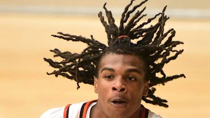 New Hanover's #1 Quin'sier Waddell comes down with the ball as New Hanover beat Heritage 62-52 in the 2nd round of the 2025 NCHSAA Basketball Championships. KEN BLEVINS/STARNEWS