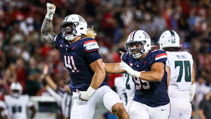 Aug 30, 2025; Tucson, Arizona, USA; Arizona Wildcats defensive Lineman Julian Savaiinaea (41) celebrates after he intercepts the ball from the Hawaii Rainbow Warriors during the third quarter at Arizona Stadium. Mandatory Credit: Aryanna Frank-Imagn Images