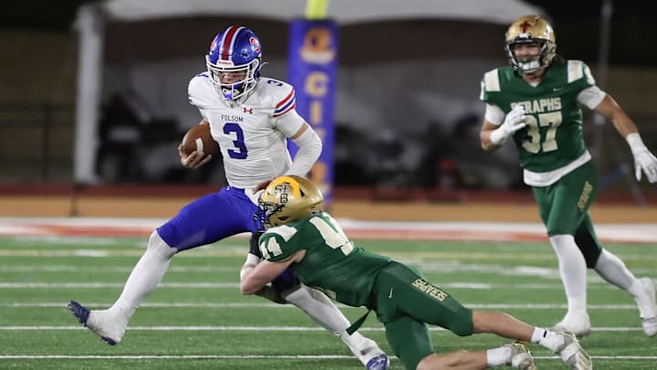 St. Bonaventure's Dylan Dunst tackles Folsom quarterback Ryder Lyons during the fourth quarter of the CIF-State Division 1-A state championship bowl at Saddleback College in Mission Viejo on Saturday, Dec. 9, 2023. St. Bonaventure lost 20-14.
