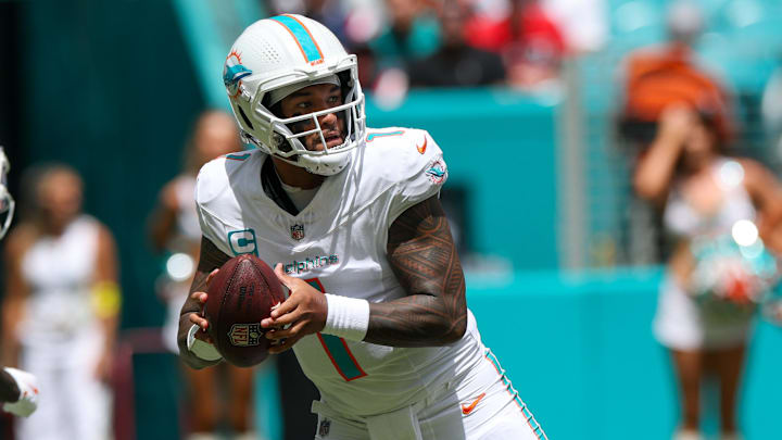 Miami Dolphins quarterback Tua Tagovailoa (1) looks to pass against the New England Patriots in the first quarter at Hard Rock Stadium. Miami Dolphins quarterback Tua Tagovailoa (1) looks to pass against the New England Patriots in the first quarter at Hard Rock Stadium.