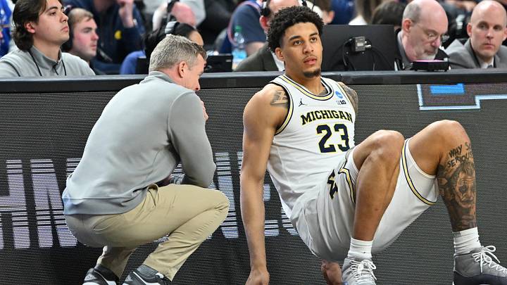 Mar 19, 2026; Buffalo, NY, USA; Michigan Wolverines head coach Dusty May talks to forward Yaxel Lendeborg (23) before a substitution against the Howard Bison during the second half of a first round game of the men's 2026 NCAA Tournament at Keybank Center. Mandatory Credit: Mark Konezny-Imagn Images