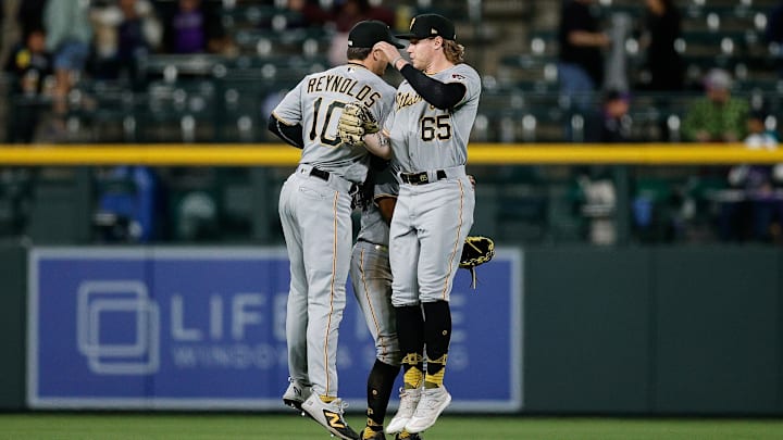 Apr 18, 2023; Denver, Colorado, USA; Pittsburgh Pirates right fielder Jack Suwinski (65) and left