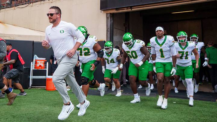 Oregon head coach Dan Lanning leads the Ducks onto the field as the Oregon Ducks face the Oklahoma State Cowboys on Sept. 12, 2026, at Boone Pickens Stadium in Stillwater, Oklahoma.