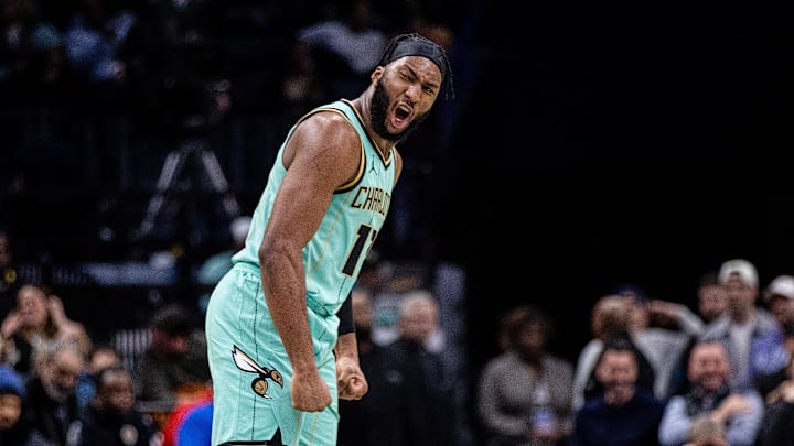 Jan 24, 2025; Charlotte, North Carolina, USA; Charlotte Hornets forward Josh Okogie (12) celebrates during the second quarter against the Portland Trail Blazers at Spectrum Center. Mandatory Credit: Scott Kinser-Imagn Images