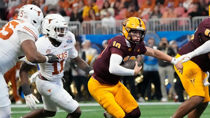 Arizona State quarterback Sam Leavitt (10) scrambles away from the Texas defense during the second quarter of the 2025 Chick-fil-A Peach Bowl in Atlanta on Wednesday, Jan. 1, 2025. Arizona State quarterback Sam Leavitt (10) scrambles away from the Texas defense during the second quarter of the 2025 Chick-fil-A Peach Bowl in Atlanta on Wednesday, Jan. 1, 2025.