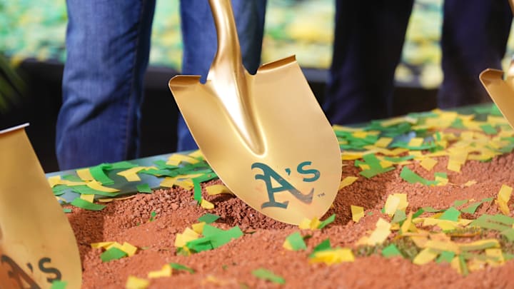 Gold shovel with Athletics on it in the dirt as the team's ceremonial groundbreaking in Las Vegas
