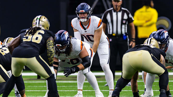 Aug 23, 2025; New Orleans, Louisiana, USA; Denver Broncos quarterback Bo Nix (10) calls for the ball against New Orleans Saints linebacker Demario Davis (56) during the first half at Caesars Superdome. 