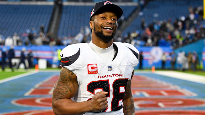 Jan 5, 2025; Nashville, Tennessee, USA;  Houston Texans running back Joe Mixon (28) smiles as he leaves the field against the Tennessee Titans during the second half at Nissan Stadium. 