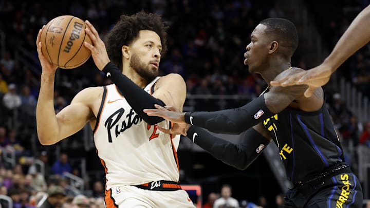 Jan 9, 2025; Detroit, Michigan, USA;  Detroit Pistons guard Cade Cunningham (2) is defended by Golden State Warriors guard Dennis Schroder (71) in the first half at Little Caesars Arena. Mandatory Credit: Rick Osentoski-Imagn Images
