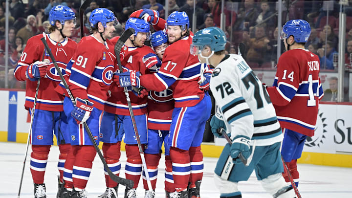 Jan 11, 2024; Montreal, Quebec, CAN; Montreal Canadiens defenseman Mike Matheson (8) celebrates with teammates forward Cole Caufield (22) and forward Juraj Slafkovsky (20) and  forward Sean Monahan (91) and forward Josh Anderson (17) and  forward Nick Suzuki (14) after scoring a goal against the San Jose Sharks during the third period at the Bell Centre. Mandatory Credit: Eric Bolte-Imagn Images