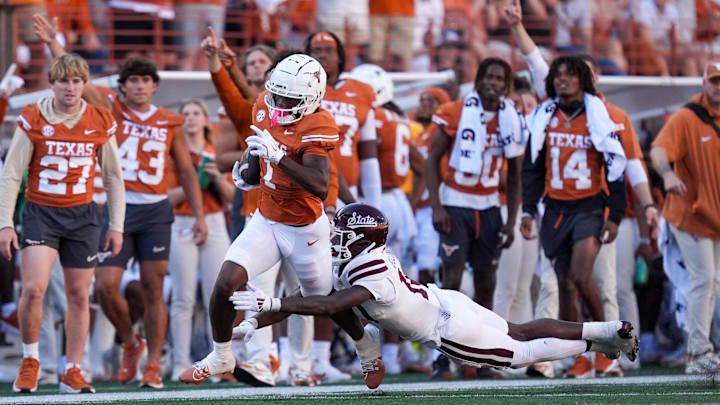 Sep 28, 2024; Austin, Texas, USA; Mississippi State Bulldogs safety Corey Ellington (10) tackles Texas Longhorns wide receiver Johntay Cook II (1) in the second half at Darrell K Royal-Texas Memorial Stadium. Mandatory Credit: Daniel Dunn-Imagn Images Sep 28, 2024; Austin, Texas, USA; Mississippi State Bulldogs safety Corey Ellington (10) tackles Texas Longhorns wide receiver Johntay Cook II (1) in the second half at Darrell K Royal-Texas Memorial Stadium. Mandatory Credit: Daniel Dunn-Imagn Images