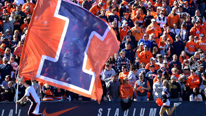 Nov 2, 2024; Champaign, Illinois, USA;  The running of the flags for the Illinois Fighting Illini during the second half against the Minnesota Golden Gophers at Memorial Stadium. Mandatory Credit: Ron Johnson-Imagn Images