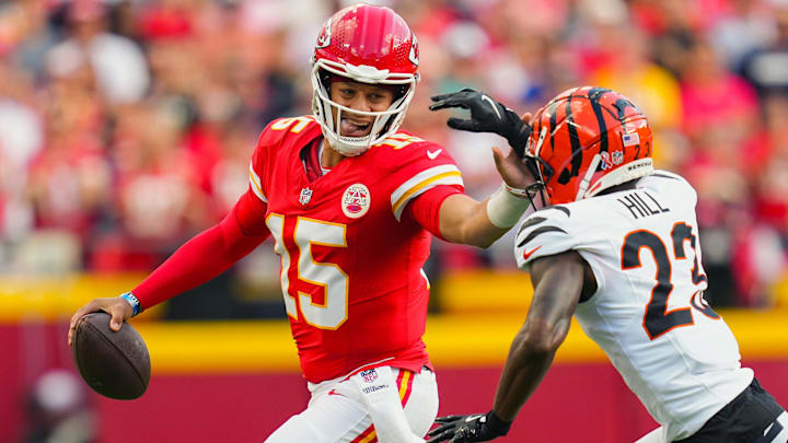 Sep 15, 2024; Kansas City, Missouri, USA; Kansas City Chiefs quarterback Patrick Mahomes (15) runs the ball against Cincinnati Bengals cornerback Dax Hill (23) during the first half at GEHA Field at Arrowhead Stadium. Mandatory Credit: Jay Biggerstaff-Imagn Images Sep 15, 2024; Kansas City, Missouri, USA; Kansas City Chiefs quarterback Patrick Mahomes (15) runs the ball against Cincinnati Bengals cornerback Dax Hill (23) during the first half at GEHA Field at Arrowhead Stadium. Mandatory Credit: Jay Biggerstaff-Imagn Images